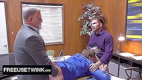 Two men have a threesome with a beautiful brunette