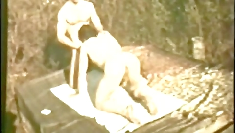 Busty 70s men are in the outdoor area with their faces covered