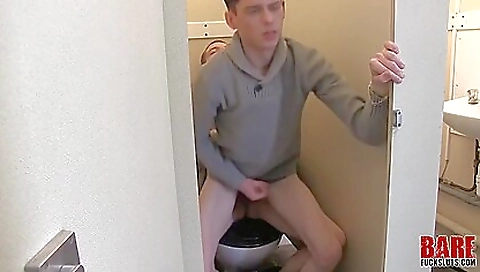 Brunette fucks with her boyfriend in the public bathroom
