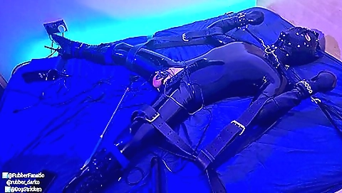 Latex bondage session with a beautiful teen girl in latex