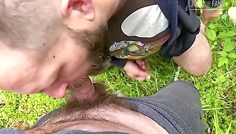 Two men are having a public hardcore sex with a brunette