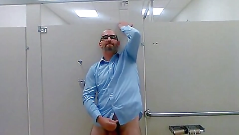 A chick rides cock in a public restroom and jerks off