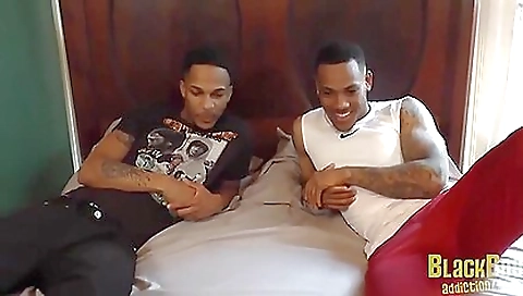 Tattooed brunette is having fun with her black partner